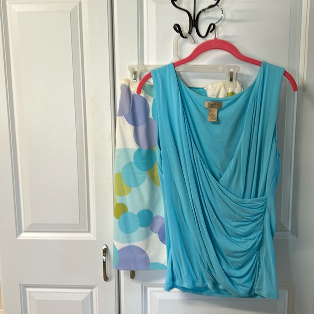Straight skirt, multicolored with blue crossover, top side, zip, & side kick.